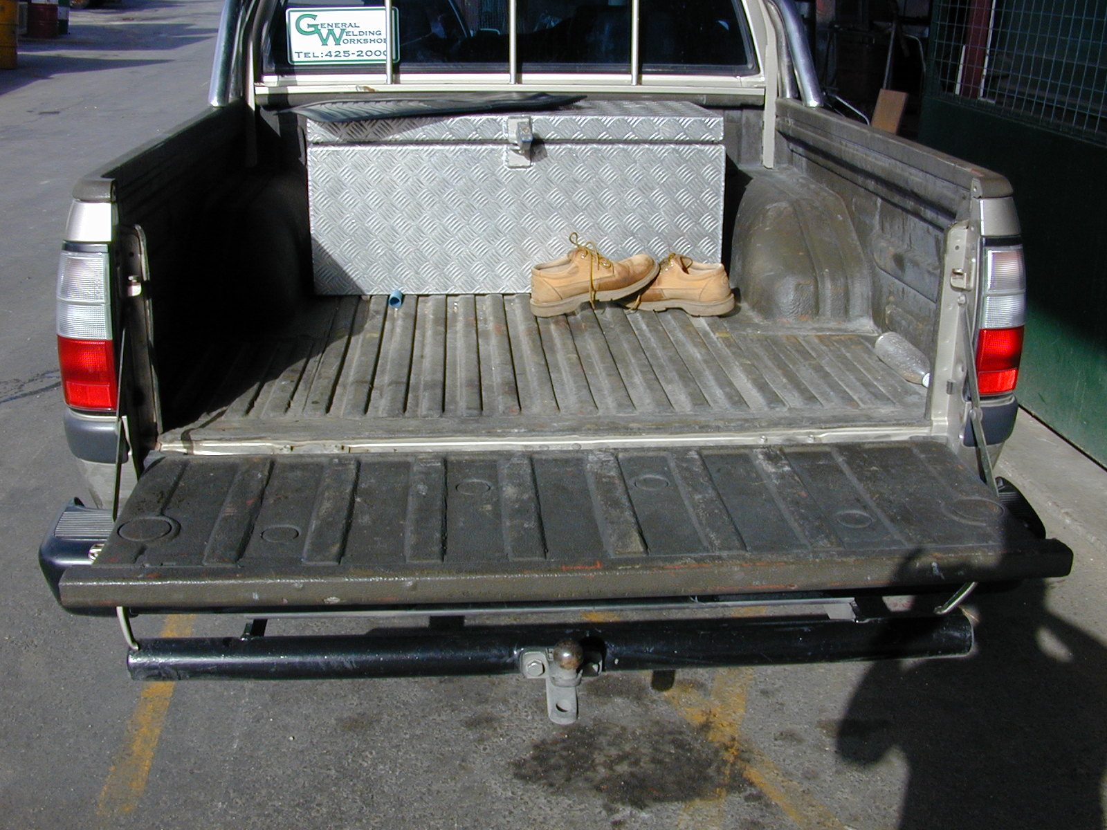 Polyurea sprayed bed liner and rust proof coating in a pickup truck bed