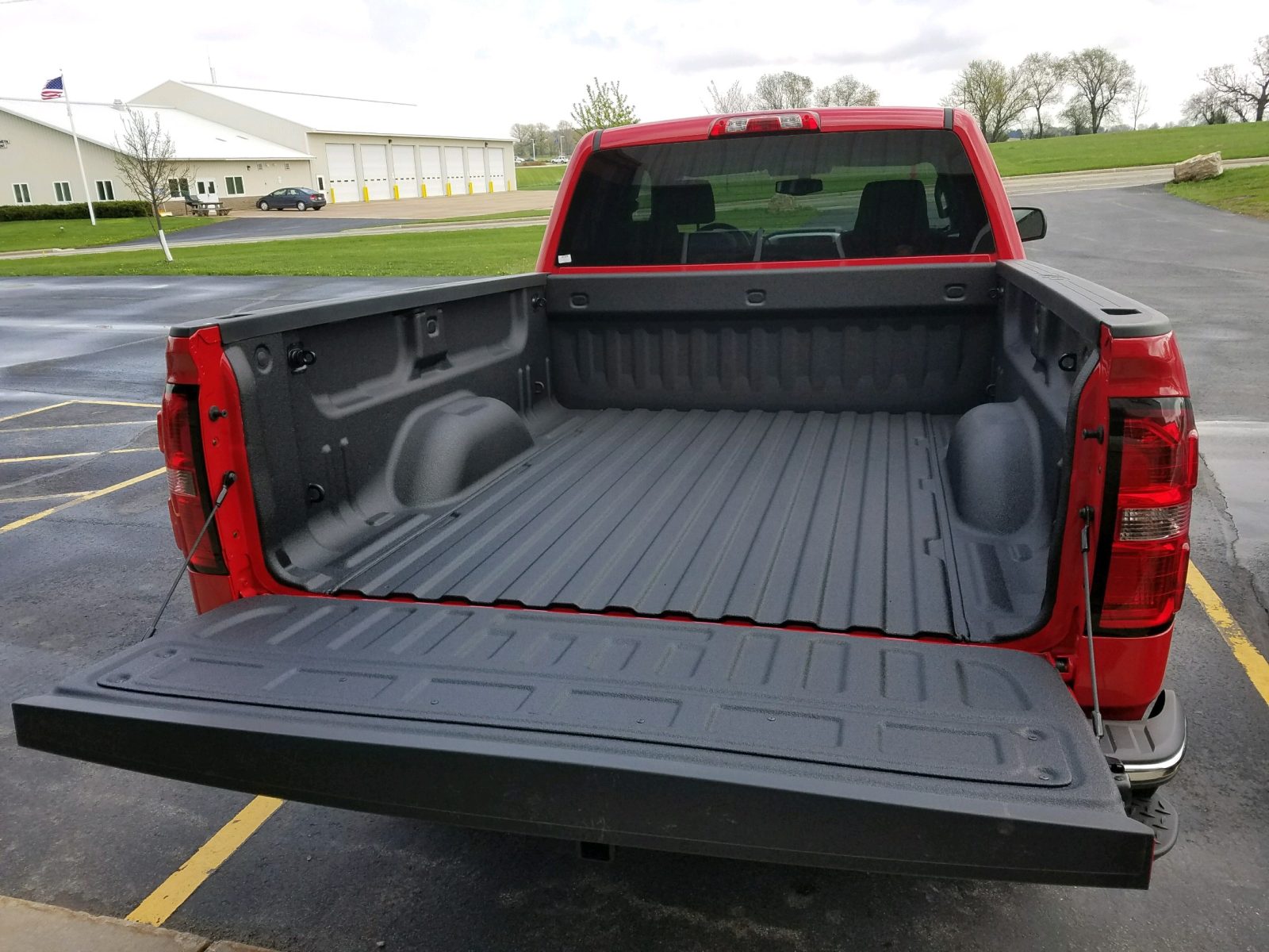 Red truck with polyurea protective bed and underbody coating